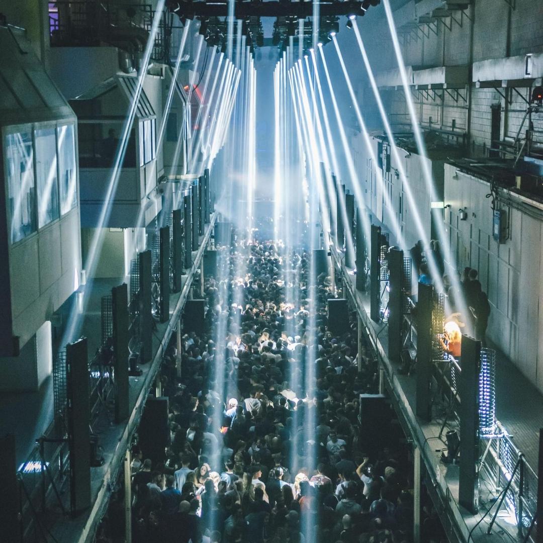 DJ performing at a darkened Berlin techno club